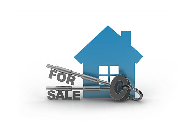 House for sale with keys isolated on white background with clipping path